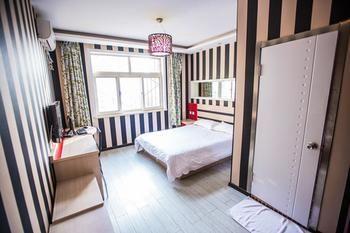 Qingdao Aisen Apartment Hotel Екстер'єр фото